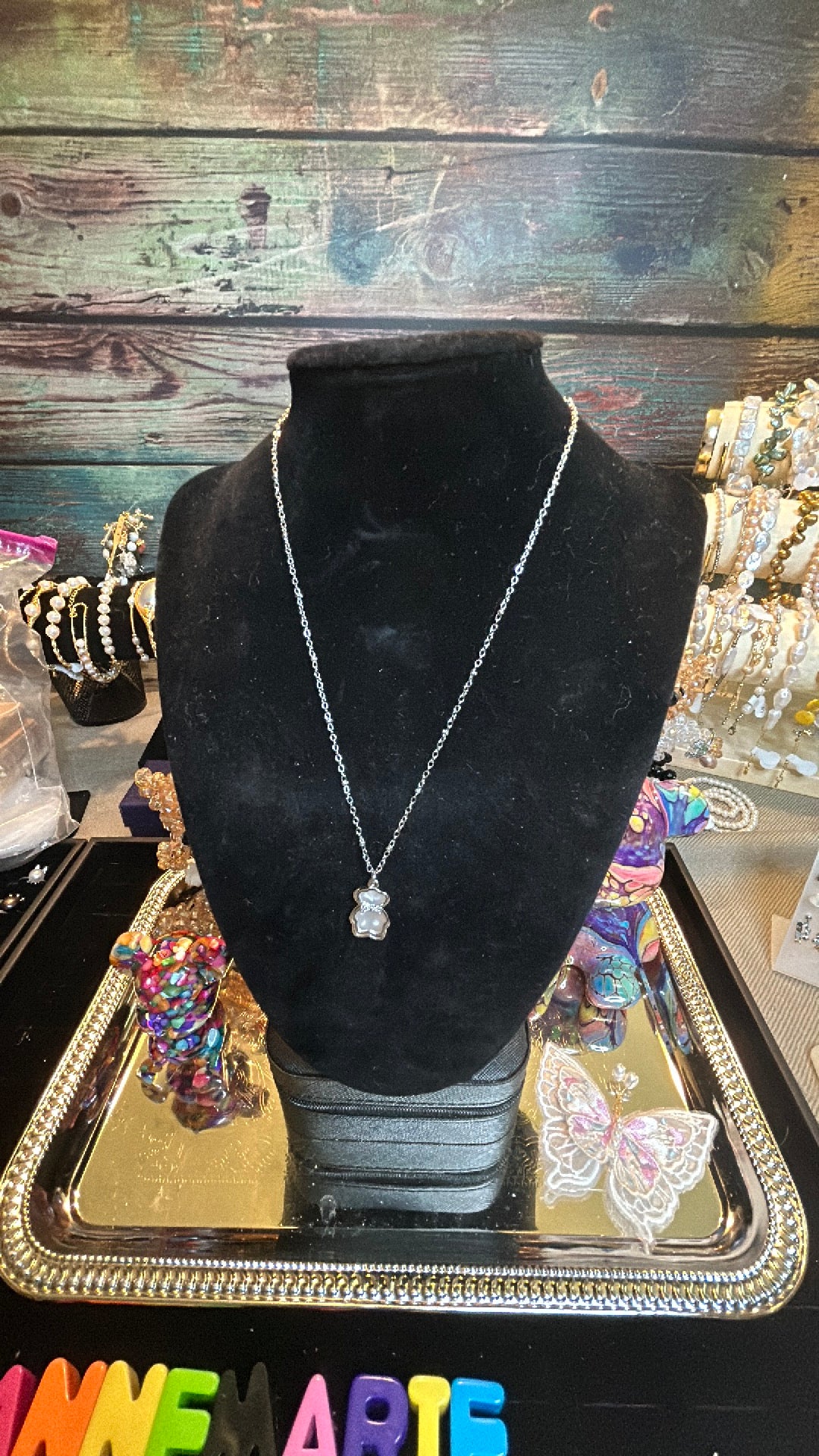 Tiny mother of pearl teddy bear necklace