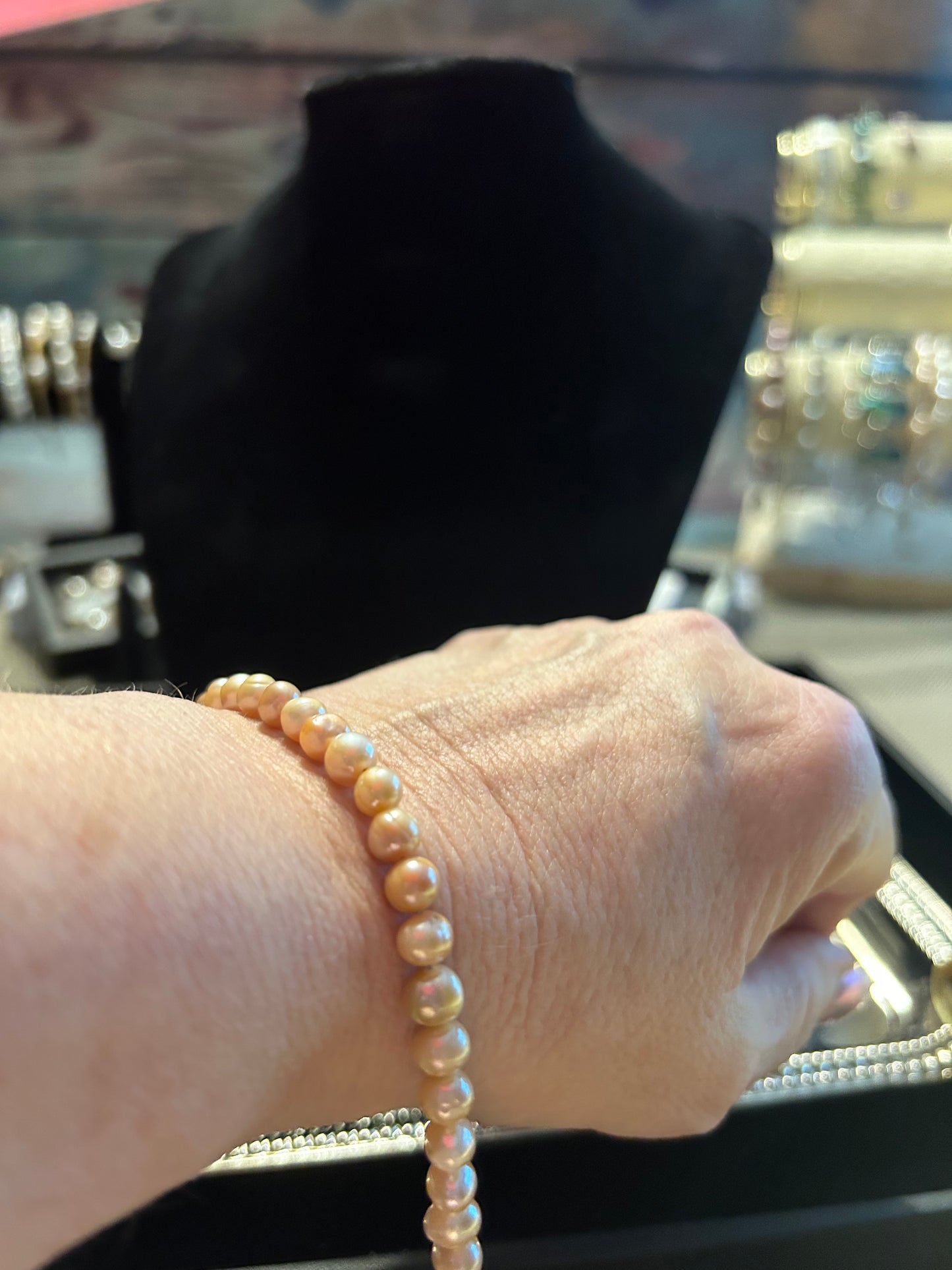 Peach colored baby freshwater pearl bracelet