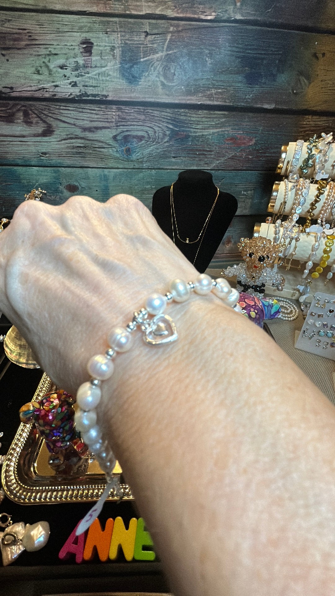 White freshwater pearl bracelet with heart charm